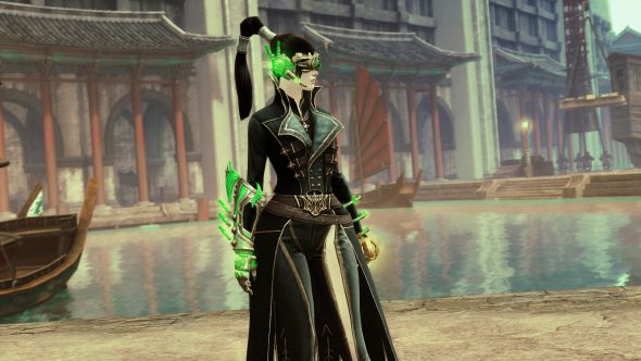A female human stands on the edge of a waterway in Cantha looking right. She wears a jade tech eye piece and gauntlets which stand out as a green contrast to her otherwise black clothing.